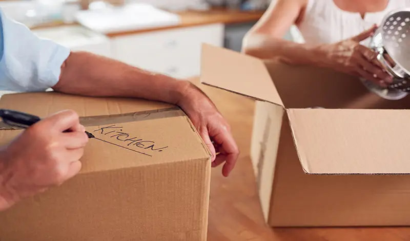 Here's What to Get Rid of Before Moving - Packing and Labeling.webp