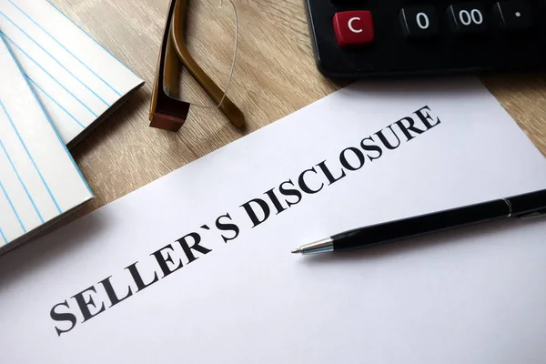 Seller reviewing disclosure documents