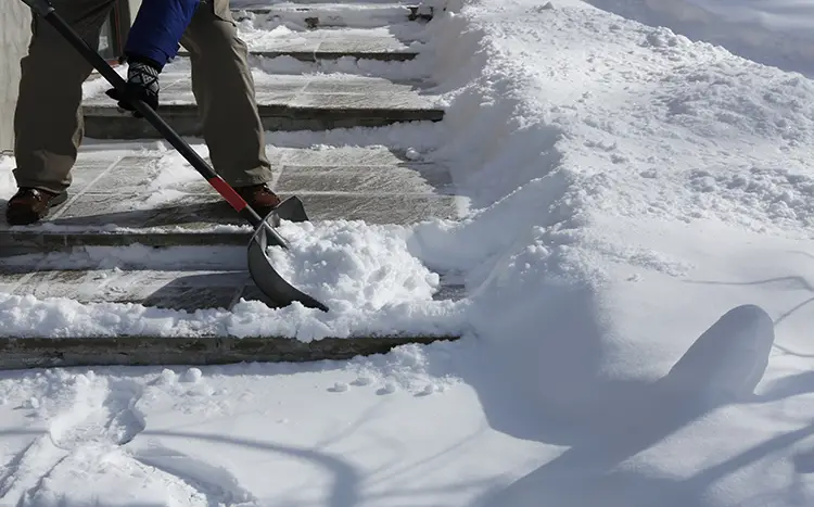 Tips for Winter Move - Clearing Snow.webp
